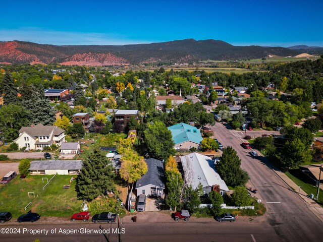 birds eye view of property featuring a mountain view