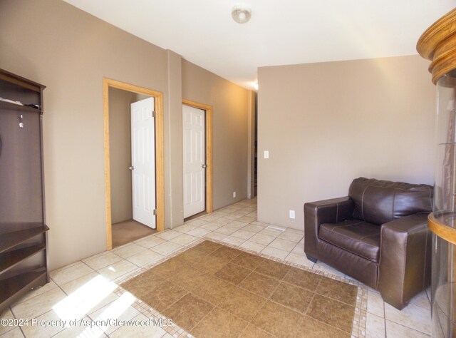 sitting room with light tile patterned floors