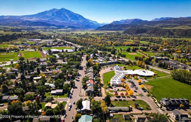 birds eye view of property featuring a mountain view