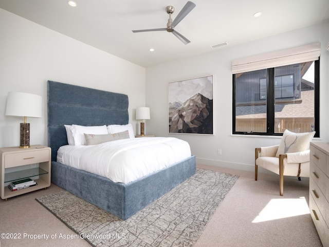 carpeted bedroom with ceiling fan