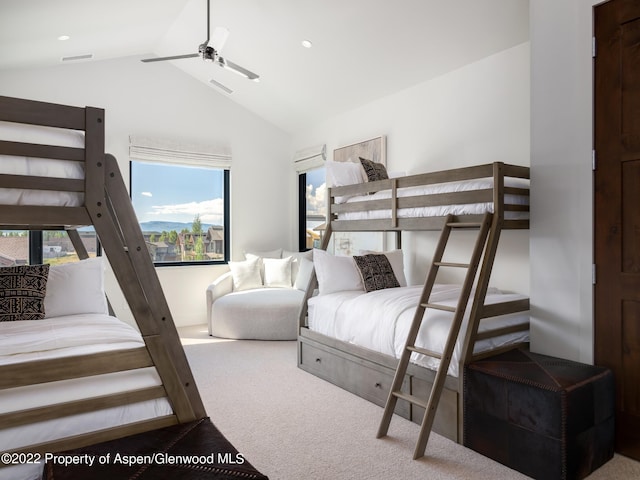 carpeted bedroom with high vaulted ceiling and ceiling fan