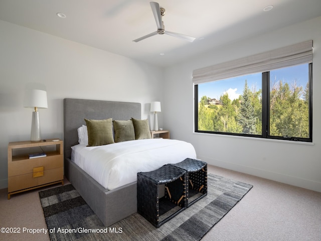 carpeted bedroom with ceiling fan