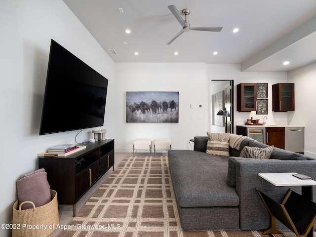 living room with ceiling fan and wine cooler