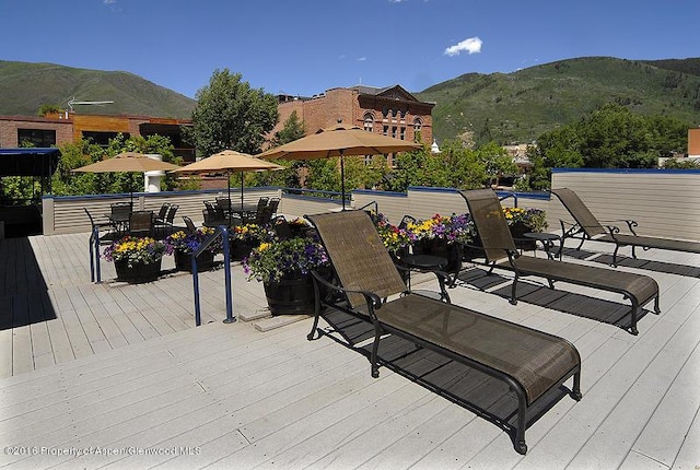 wooden terrace with a mountain view