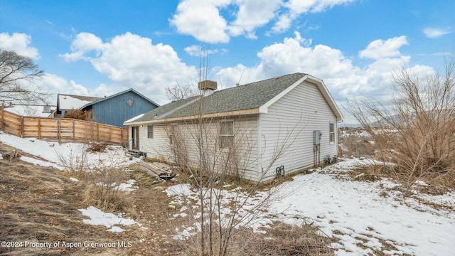 view of snow covered property