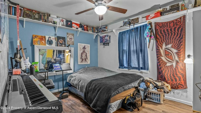 bedroom featuring ceiling fan and hardwood / wood-style flooring