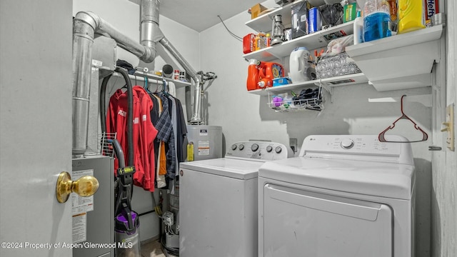 laundry area featuring gas water heater and washer and clothes dryer