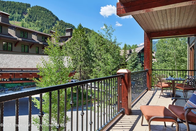 balcony featuring a mountain view