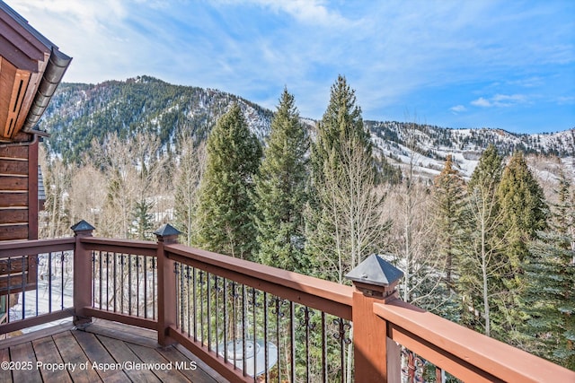 view of mountain feature with a forest view