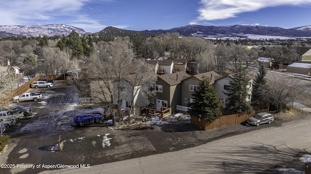 birds eye view of property featuring a mountain view