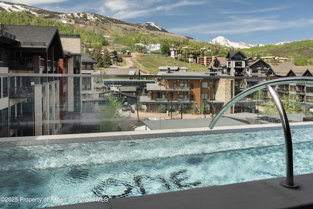 77 Wood Rd Unit 505E, Snowmass Village, CO 81615 - view of swimming pool with a mountain view