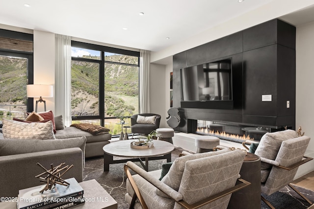 77 Wood Rd Unit 505E, Snowmass Village, CO 81615 - living room featuring recessed lighting and expansive windows