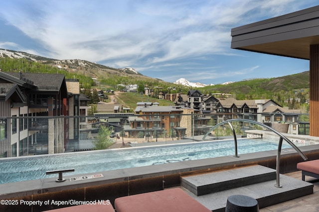 77 Wood Rd Unit 505E, Snowmass Village, CO 81615 - community pool featuring a mountain view and a residential view