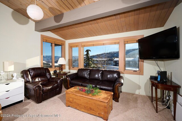 carpeted living room featuring vaulted ceiling with beams and wood ceiling