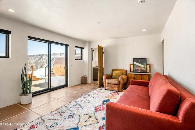 tiled living room with a mountain view