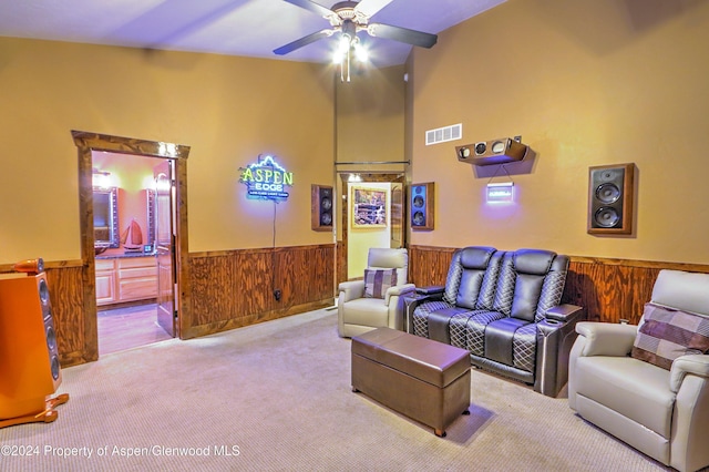 living room featuring light colored carpet and ceiling fan