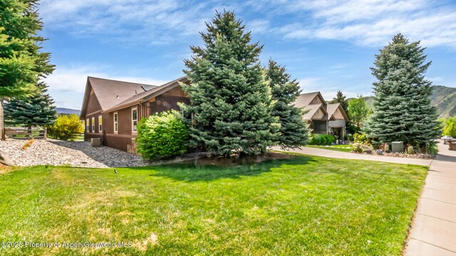 168 Blackhawk Dr, New Castle, CO 81647 - view of side of home featuring a lawn
