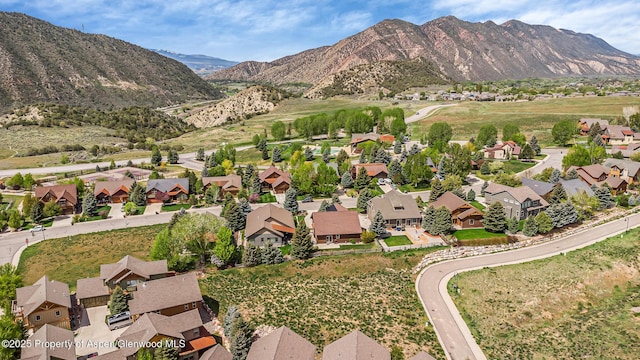 168 Blackhawk Dr, New Castle, CO 81647 - aerial view of property and surrounding area with nearby suburban area and mountains