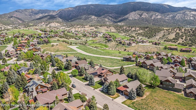168 Blackhawk Dr, New Castle, CO 81647 - aerial view of property's location featuring nearby suburban area and a mountainous background