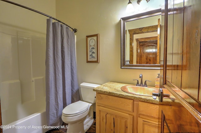 full bathroom featuring shower / bath combo, toilet, and vanity