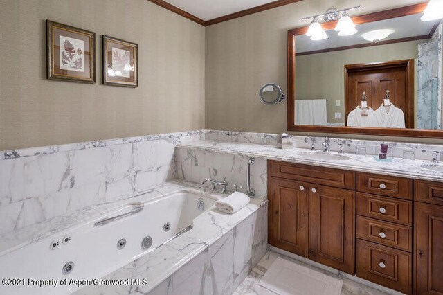 bathroom with double vanity, ornamental molding, a whirlpool tub, marble finish floor, and a sink