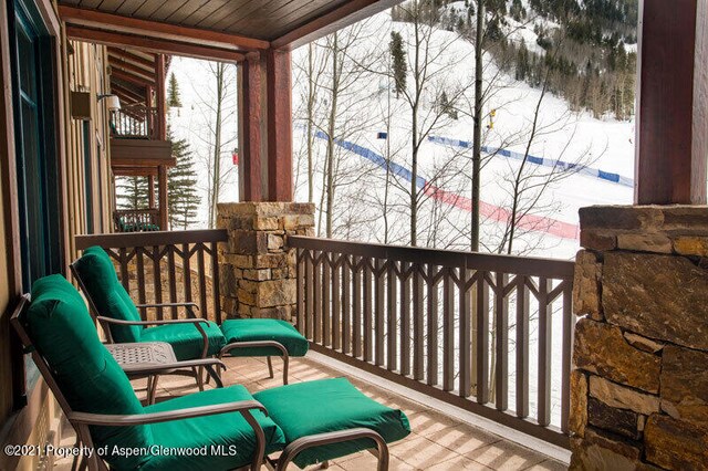 sunroom with wooden ceiling