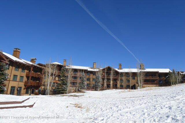 view of snow covered property