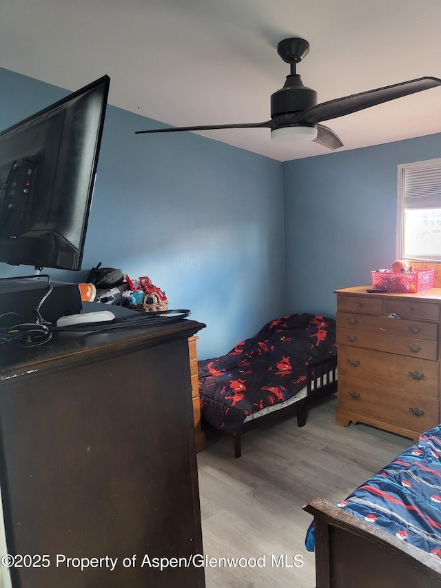 bedroom featuring ceiling fan and light hardwood / wood-style floors