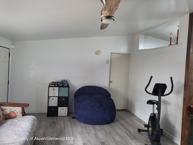 interior space featuring hardwood / wood-style flooring and lofted ceiling