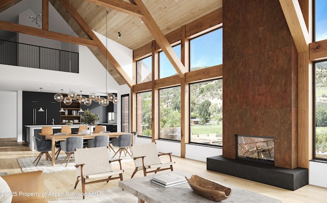902/904 Sopris Creek Rd, Basalt, CO 81621 - living room featuring high vaulted ceiling, wood finished floors, a fireplace, a chandelier, and a wood ceiling with exposed beams