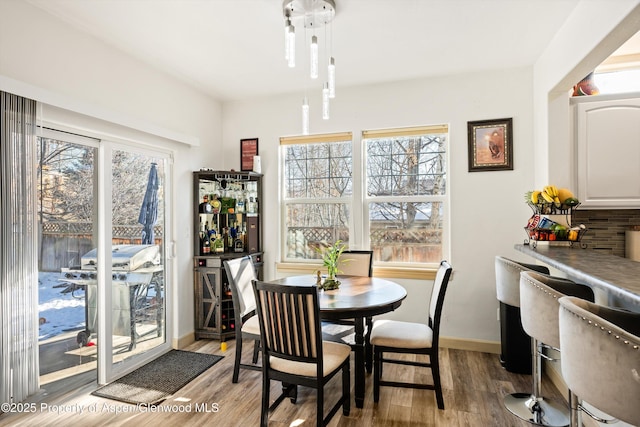 dining area with light wood-type flooring