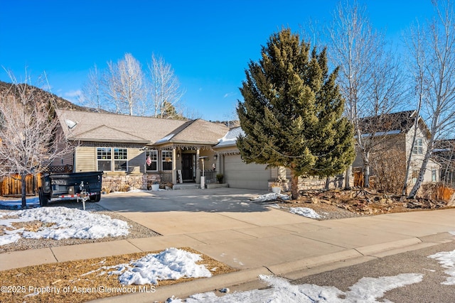 view of front of home with a garage and a hot tub