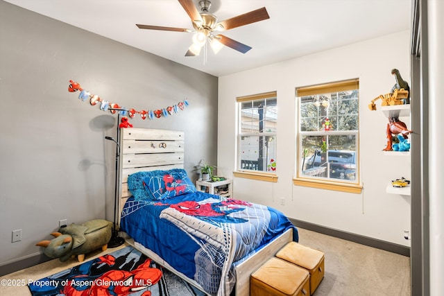 carpeted bedroom with ceiling fan