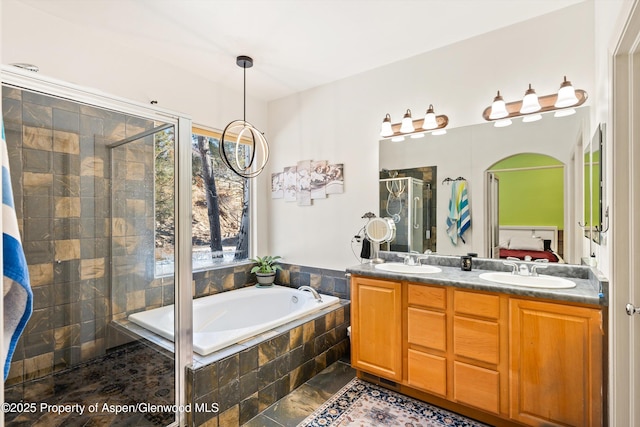 bathroom featuring vanity and plus walk in shower