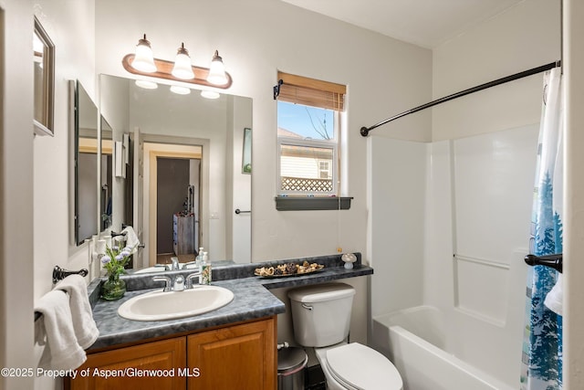 full bathroom with vanity, tub / shower combination, and toilet