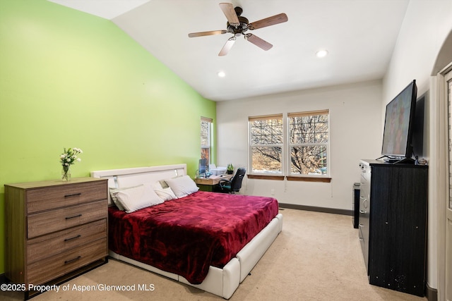 bedroom with lofted ceiling, light carpet, and ceiling fan