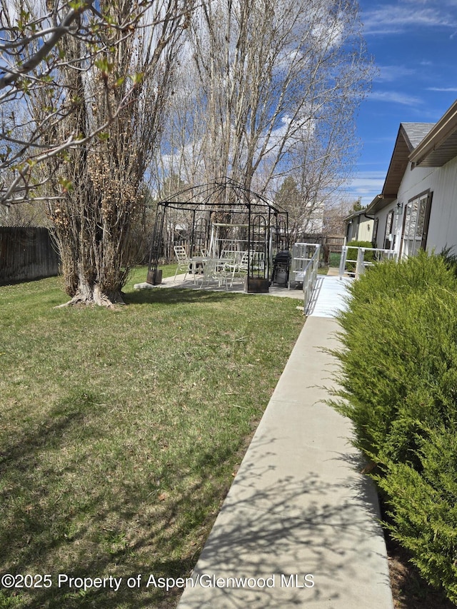 view of yard with fence