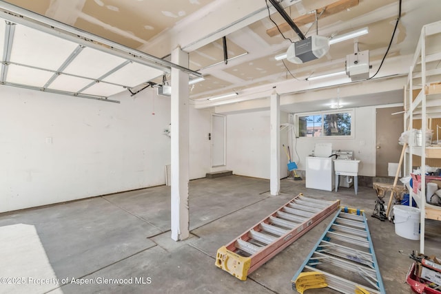 1020 Alta Vista Dr, Craig, CO 81625 - garage with a garage door opener and washer / clothes dryer