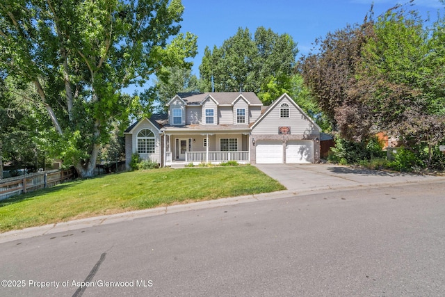 1020 Alta Vista Dr, Craig, CO 81625 - traditional-style home featuring a porch, driveway, and an attached garage