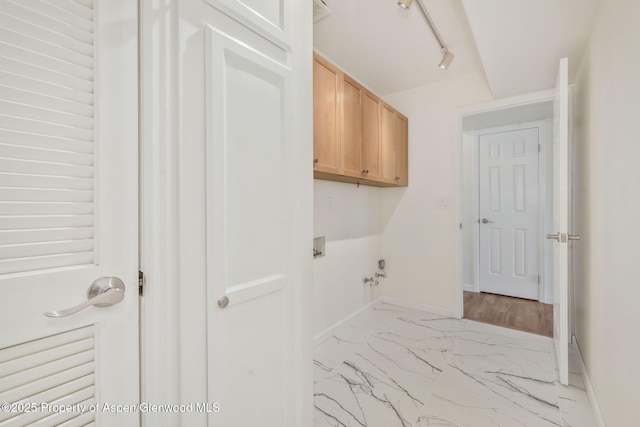 1020 Alta Vista Dr, Craig, CO 81625 - laundry room featuring cabinet space, hookup for a washing machine, and light marble finish floors
