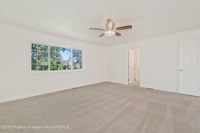 1020 Alta Vista Dr, Craig, CO 81625 - spare room featuring a ceiling fan, ornamental molding, and light carpet