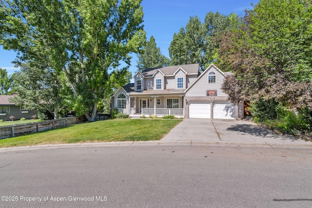 1020 Alta Vista Dr, Craig, CO 81625 - traditional-style house featuring a porch, concrete driveway, and a garage