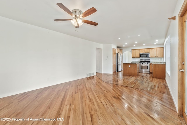 1020 Alta Vista Dr, Craig, CO 81625 - unfurnished living room with recessed lighting, light wood finished floors, and ceiling fan
