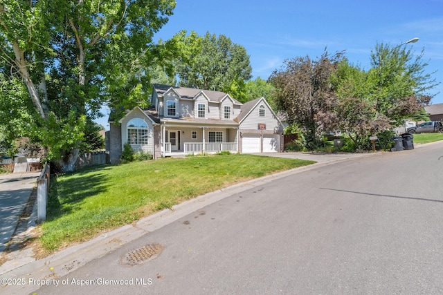 1020 Alta Vista Dr, Craig, CO 81625 - traditional-style house with covered porch, driveway, and a garage