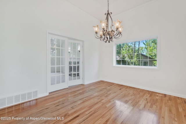 1020 Alta Vista Dr, Craig, CO 81625 - unfurnished room featuring a chandelier and wood finished floors