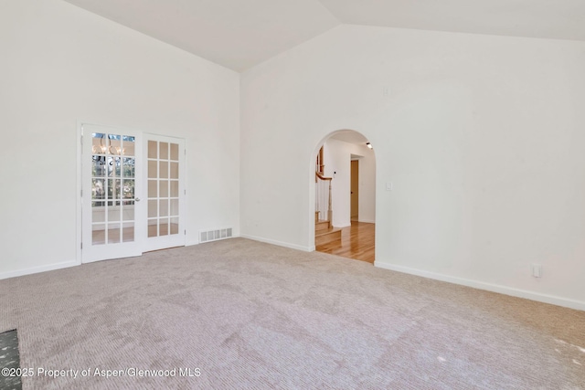 1020 Alta Vista Dr, Craig, CO 81625 - carpeted empty room featuring arched walkways and high vaulted ceiling