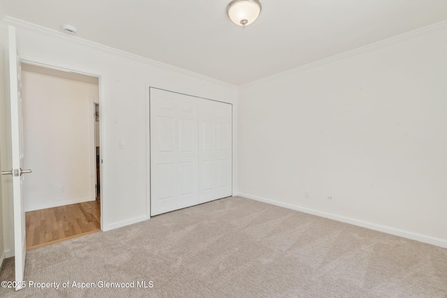 1020 Alta Vista Dr, Craig, CO 81625 - unfurnished bedroom with carpet, crown molding, and a closet