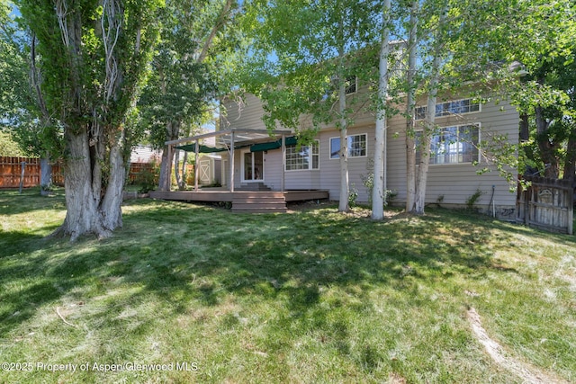 1020 Alta Vista Dr, Craig, CO 81625 - rear view of property featuring a fenced backyard, a wooden deck, and a pergola