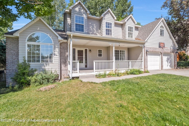 1020 Alta Vista Dr, Craig, CO 81625 - traditional-style home with covered porch, a front yard, concrete driveway, brick siding, and roof with shingles