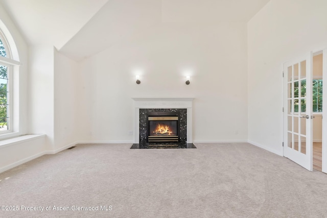 1020 Alta Vista Dr, Craig, CO 81625 - unfurnished living room with carpet, a fireplace, and high vaulted ceiling
